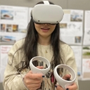 Appalachian State senior interior design student tests a VR set to wander through virtual spaces.